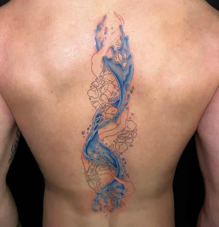 Unfinished blue water swirling like DNA spine tattoo