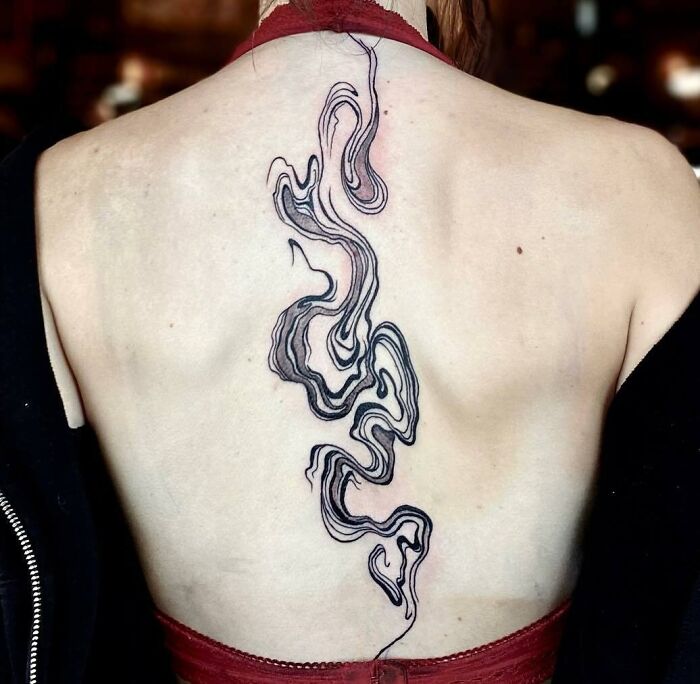 Optical and abstract spine tattoo