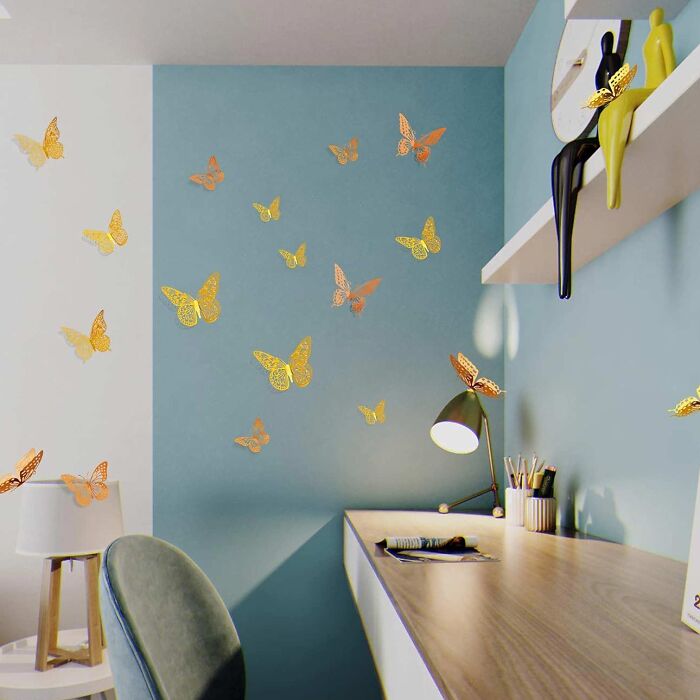Many yellow 3D butterflies - decoration on the wall