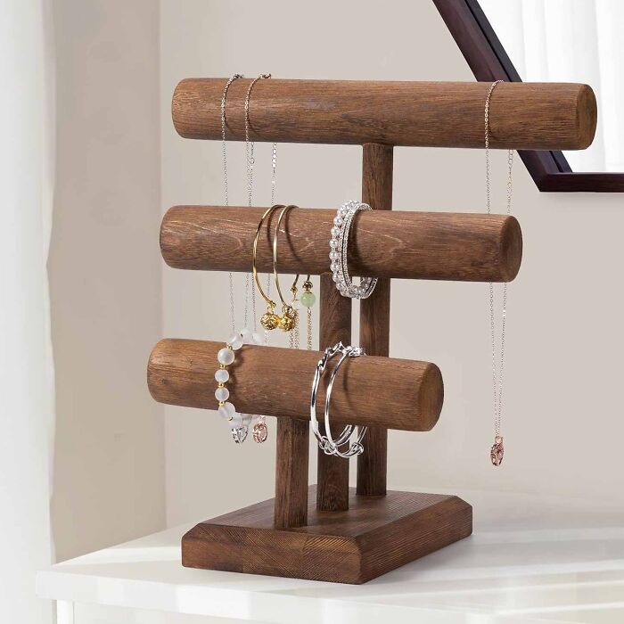 Brown wooden bracelet holder with jewelry