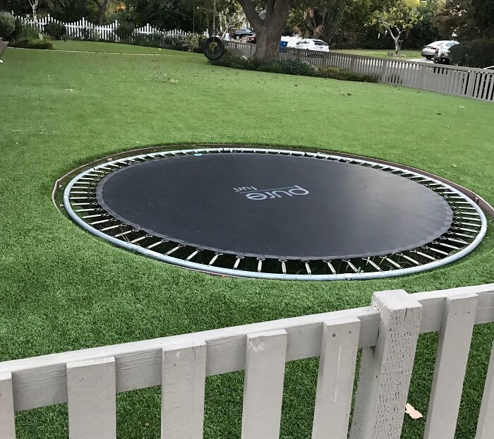 Inground trampoline in a massive backyard 