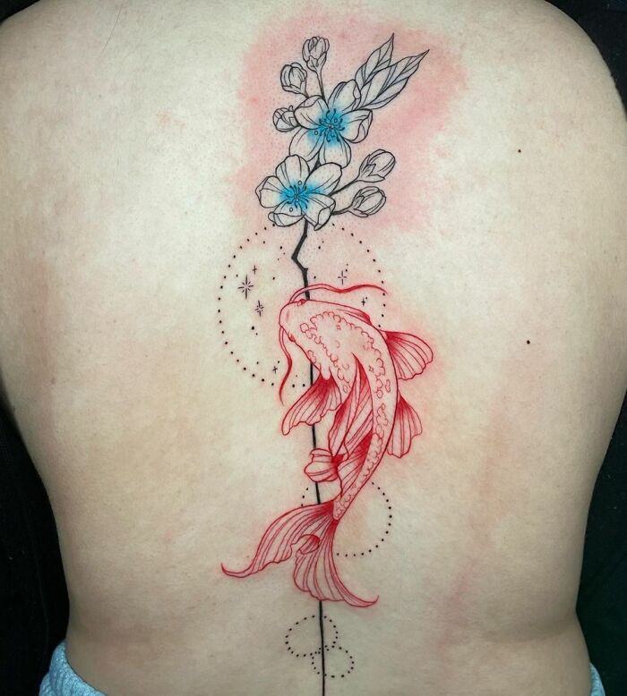 Koi fish and cherry blossoms spine tattoo with intricate dotted design on back.