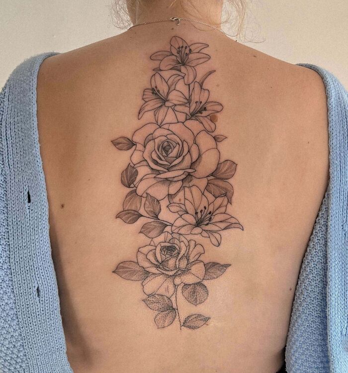 Large floral spine tattoo
