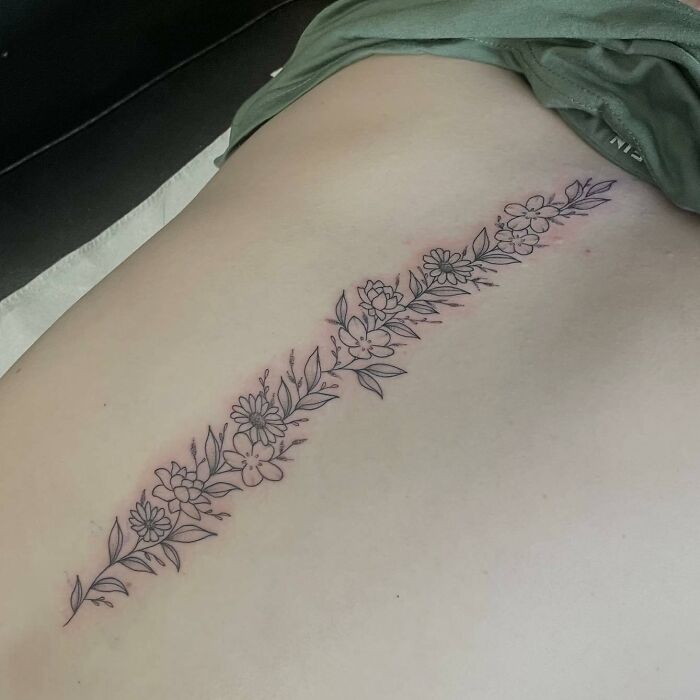 Spine tattoo with flowers