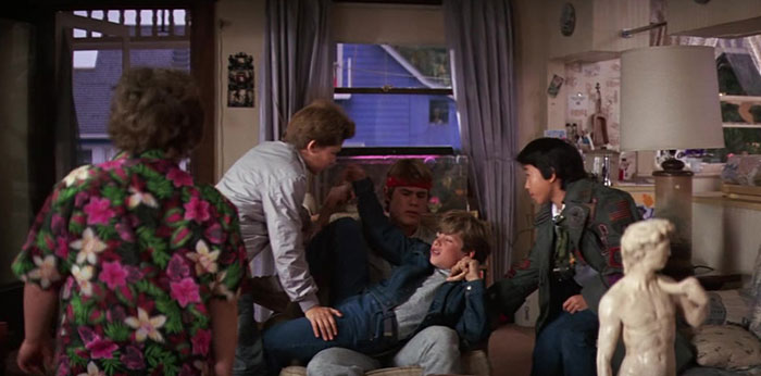 Five boys discussing in the room 