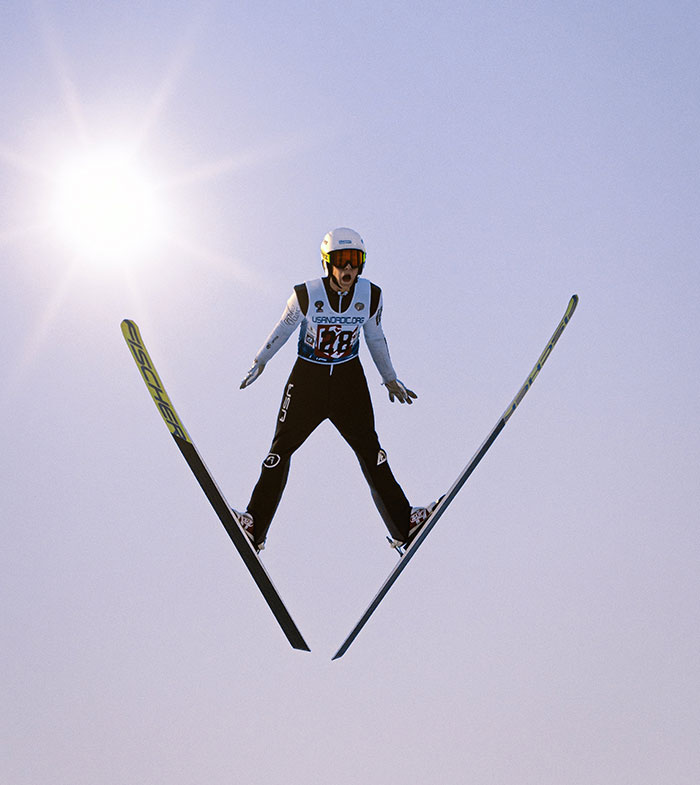 Ski Jumper in the air and the Sun