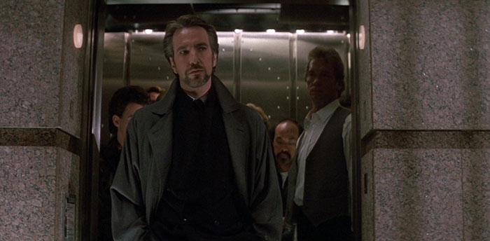 Multiple men coming out from an elevator 