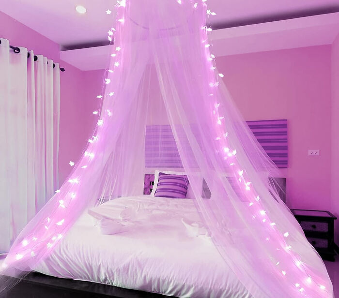 Purple bed canopy with LED star lights