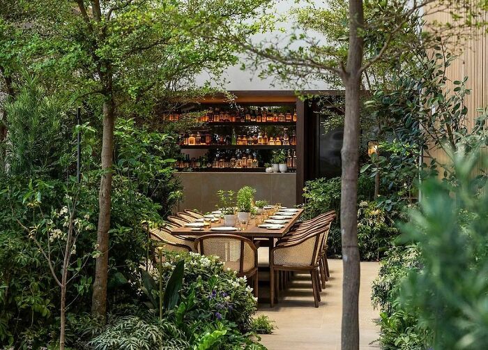 Green Dining Nook with a bar in a backyard 