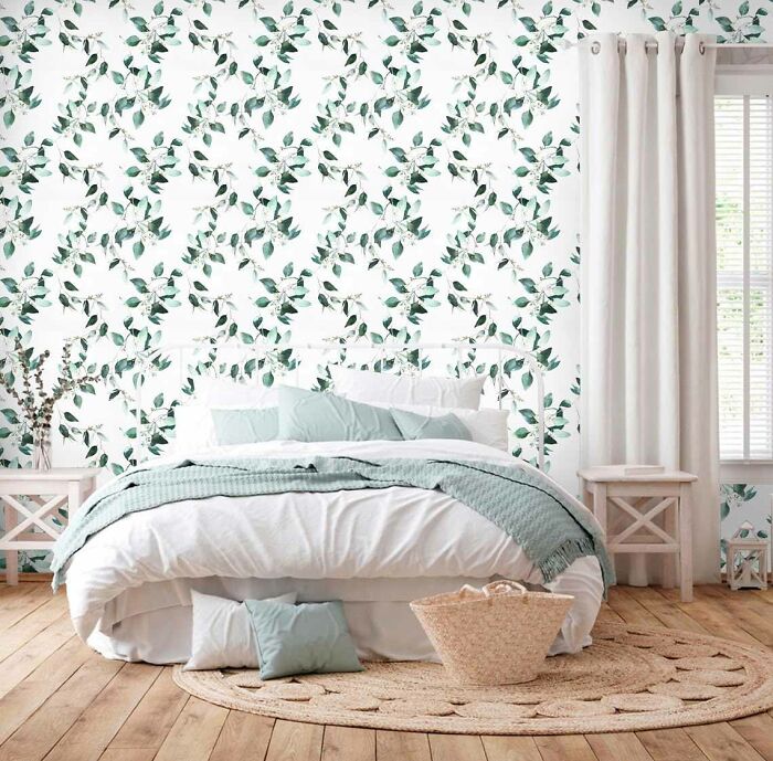 Boho green and white floral wallpaper in the bedroom