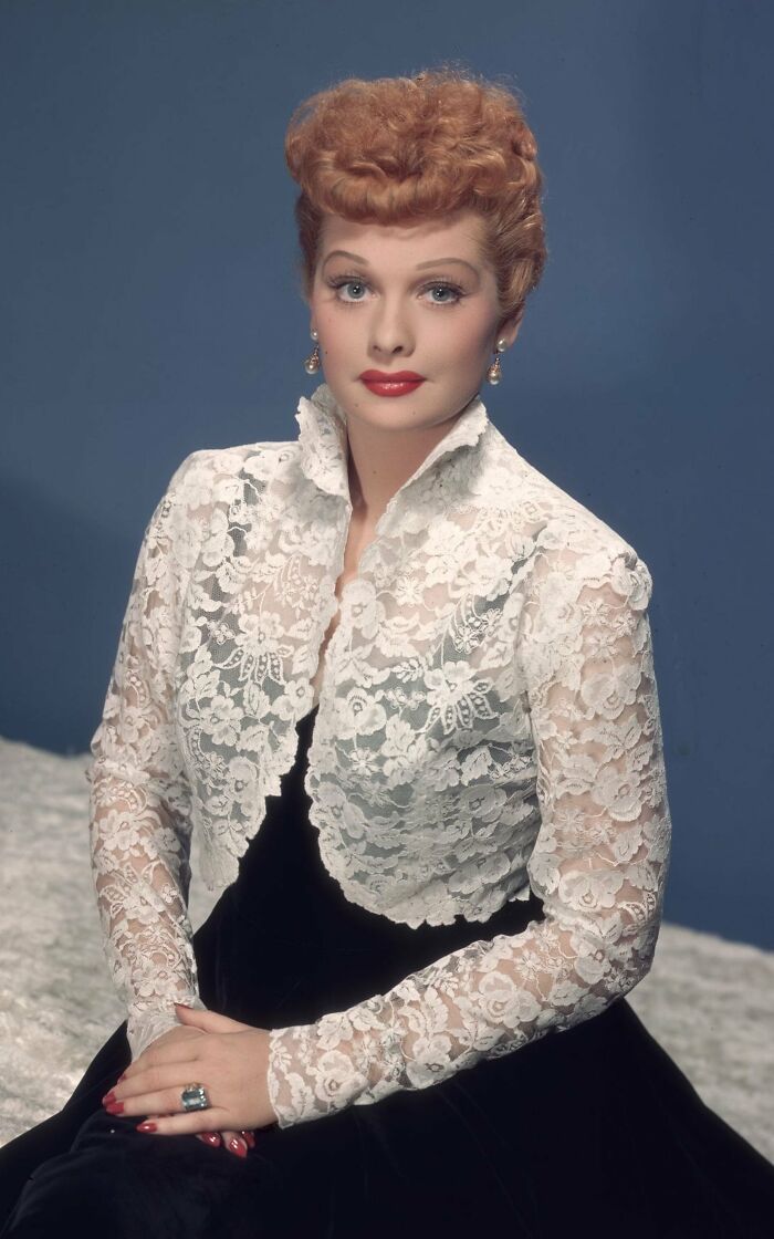 Lucille Ball sitting on bed 