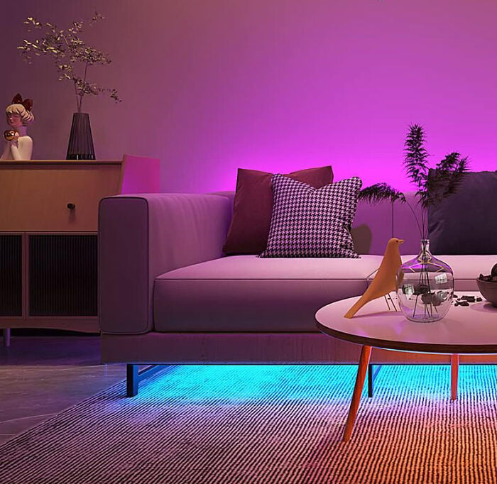 Room with sofa and lighted purple LED lights