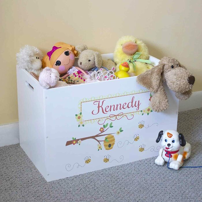 Wooden personalized white open toy crate with many stuffed toys in it