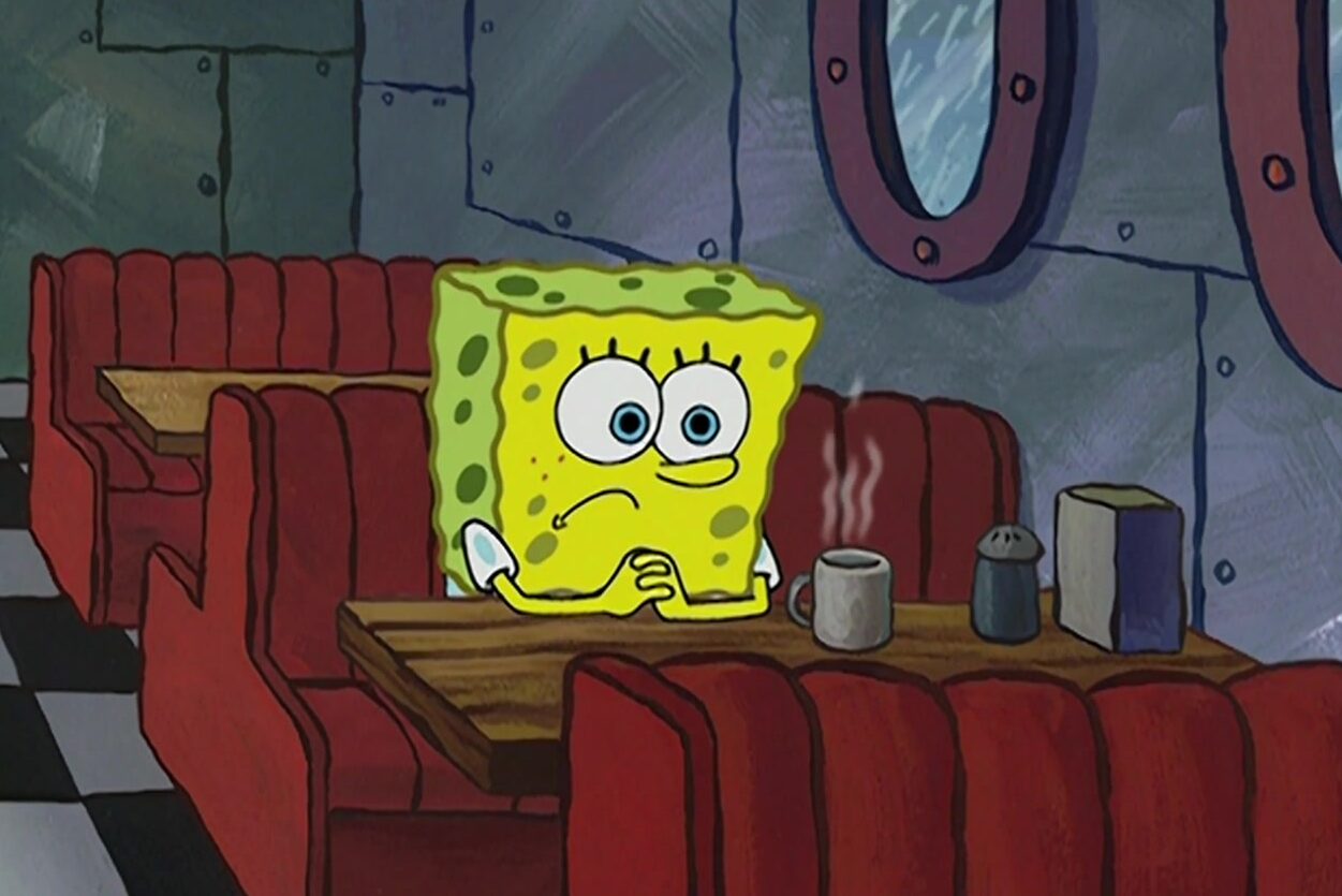 Spongebob sitting alone at coffee shop