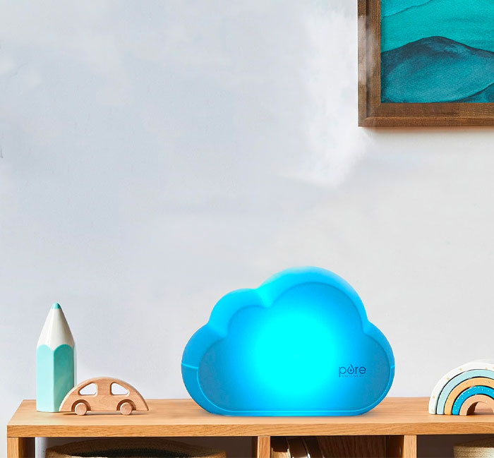 A blue humidifier in the form of the cloud on the shelf