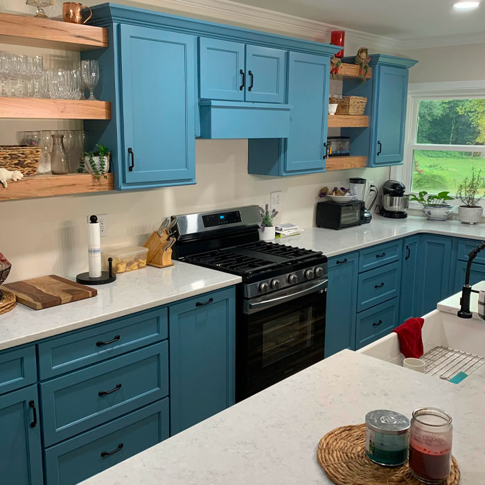 Light blue kitchen cabinets with open shelves