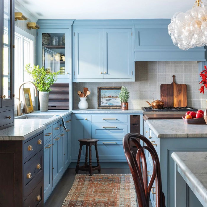 Light blue kitchen cabinets with gray tiles