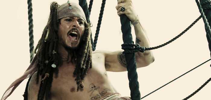 Johnny Depp holding or ropes and shouting 