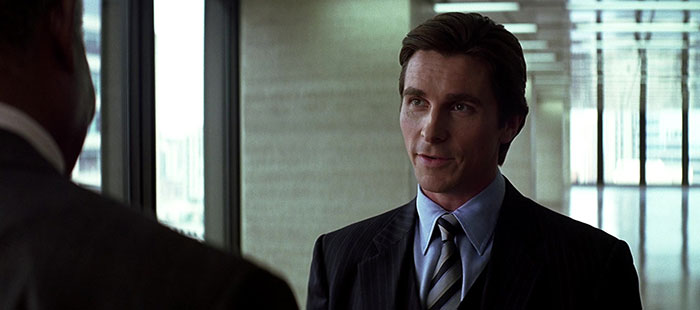 Christian Bale looking at someone and talking 