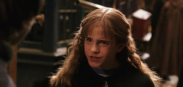 Ginger girl dressed in black talking 