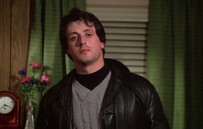 Sylvester Stallone looking at someone 