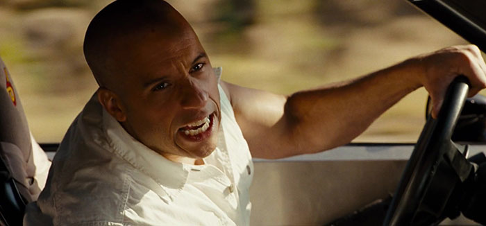 Vin Diesel shouting and driving a car 