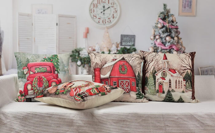 Sofa with christmas pillows in the middle of the room