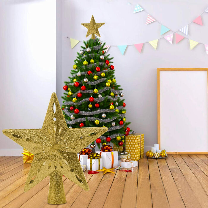 a gold star tree topper on the backgrouna of a christmas tree
