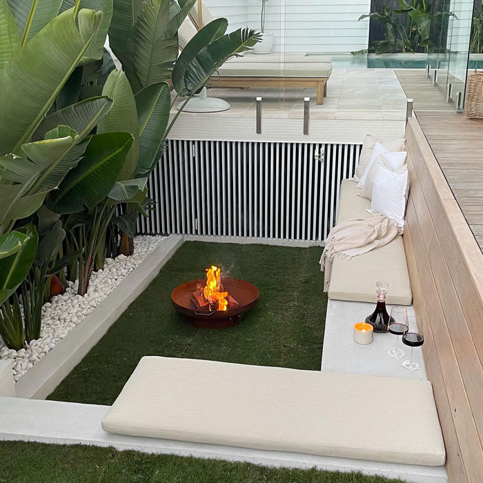 Outdoor fire pit near a pool 