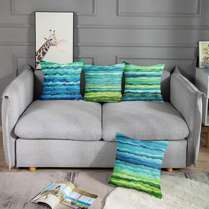 Multicolored pillows on gray sofa 