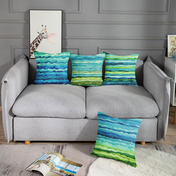 Multicolored pillows on gray sofa Multicolored pillows on gray sofa