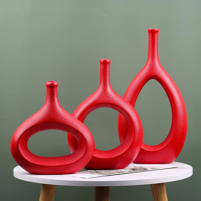 Three Unique res vases on the table Three Unique res vases on the table