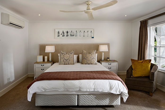 Master bedroom with a ceiling fan