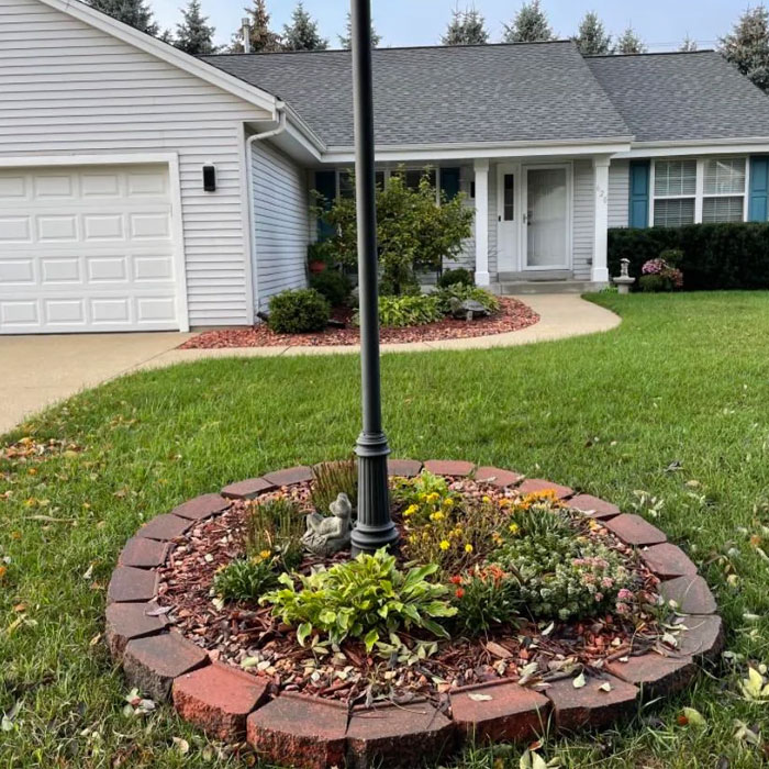 Front yard with garden lamp post with planter