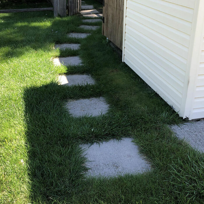 Front yard with square pavers as steps