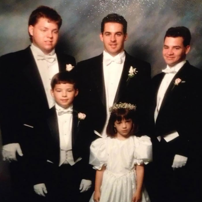 My Childhood Friend's 1991 Family Portrait, Where All Of Her Brothers Look Like They're Protecting A Crown Jewel Of A Crime Family