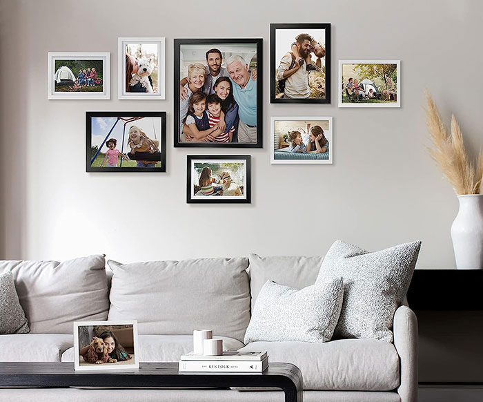 Colorful photographs hanging on the wall.