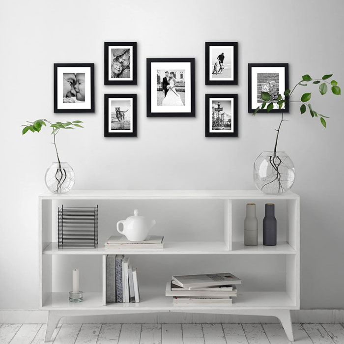 Black and white photographs hanging on the wall.
