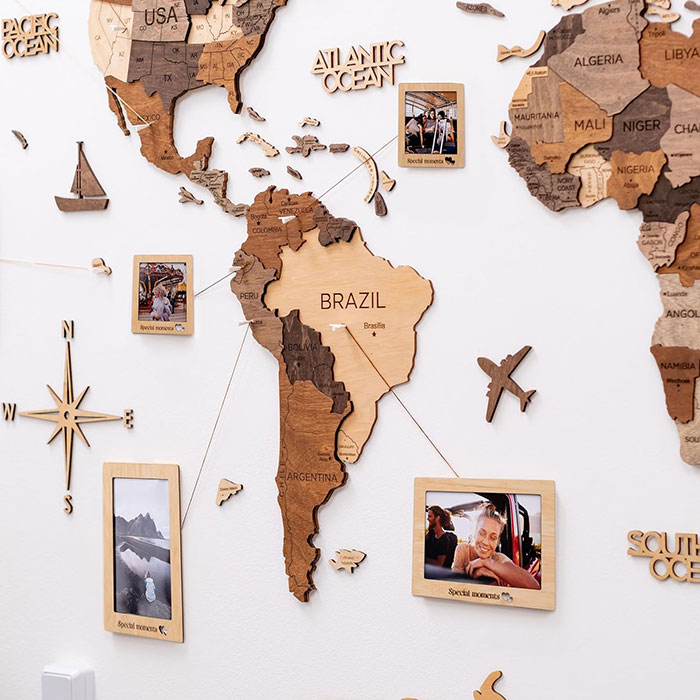 Wooden world map hanging on the wall.