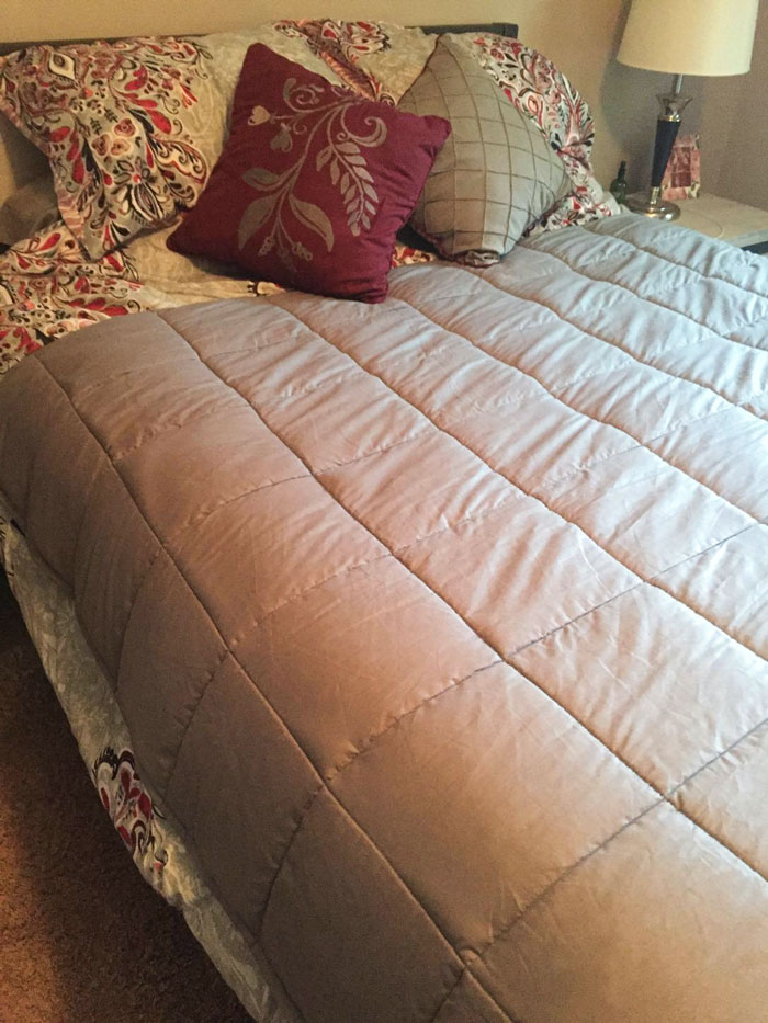 Weighted Blanket: It is your girlfriend's new ticket to the best sleep of her life. With its unique 7-layer system and customizable weight design, it's more than just a blanket, it's like a comfy cloud she can actually touch.