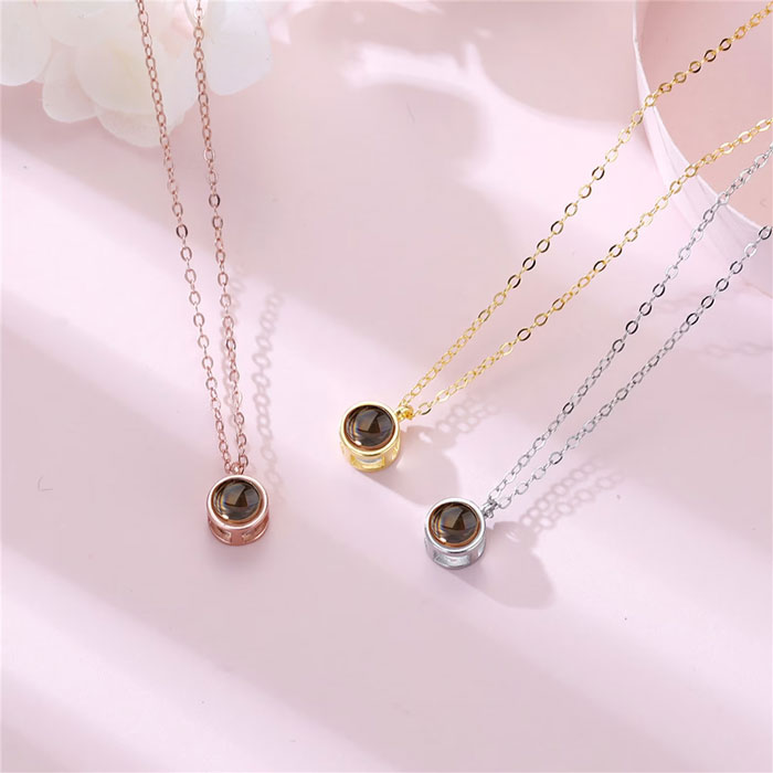 Bubble Projection Necklace: 'Cause nothing says ‘I love you’ more than a tiny photo memory carried close to her heart!
