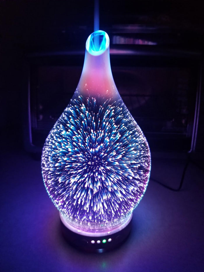 Essential Oil Diffuser: Boasting a unique handblown glass design and mesmerizing LED lights, for your significant other to create a soothing, personalized sanctuary.