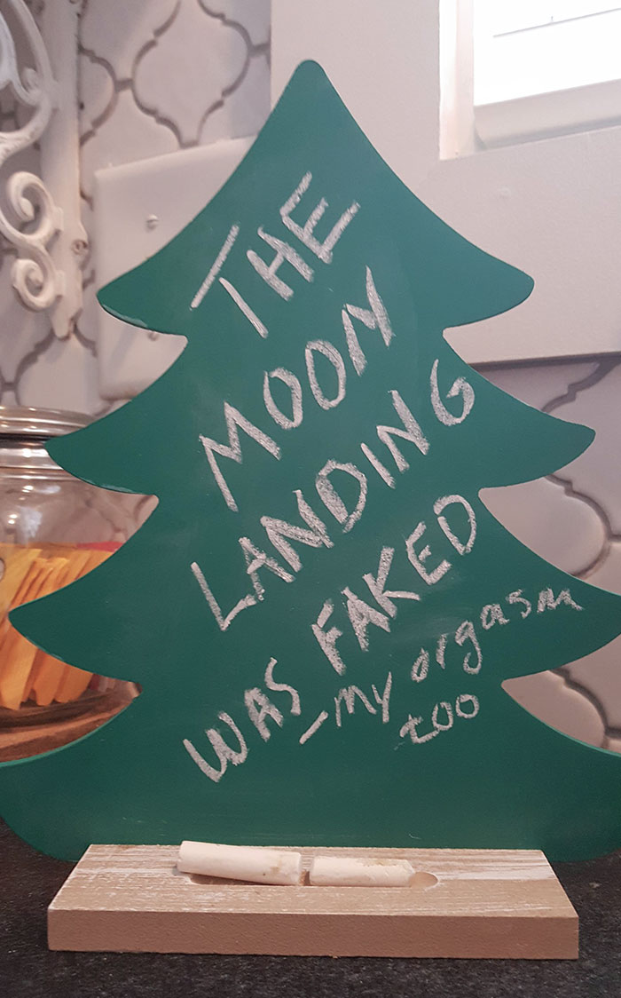 Wife Bought A Chalkboard Christmas Tree To Count Down The Number Of Days Until Christmas. I've Been Erasing The Number And Writing Conspiracy Theories Instead, Infuriating Her