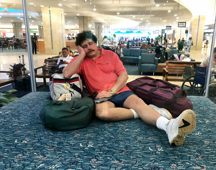 This Statue Of An Exhausted Traveler In Orlando International Airport