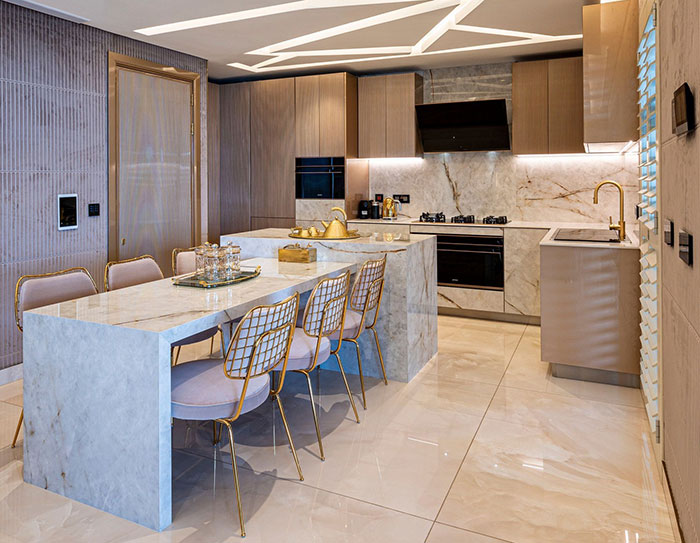 Bright modern kitchen with gold parts Bright modern kitchen with gold parts