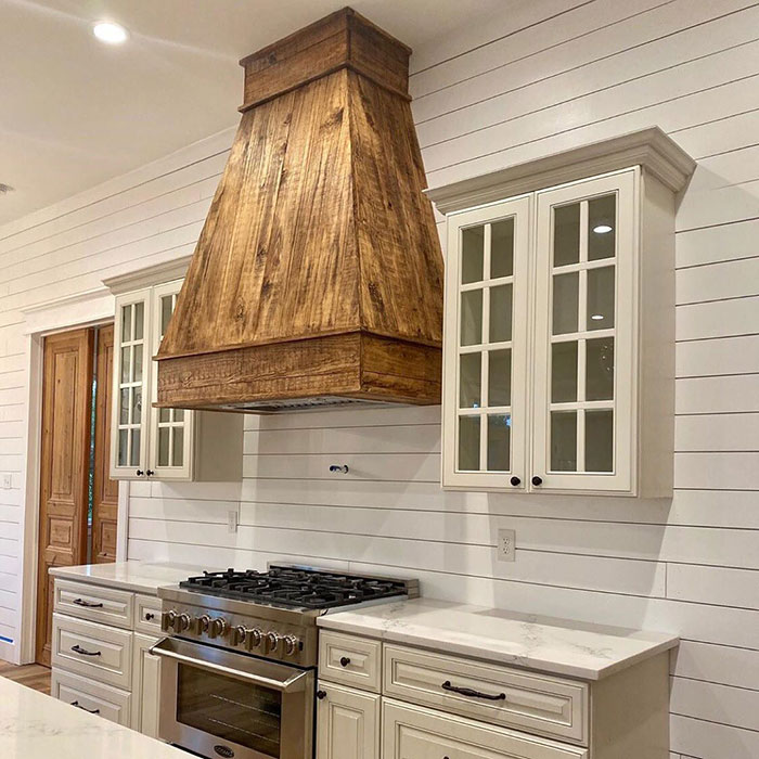 Statement wooden hood in a small kitchen 