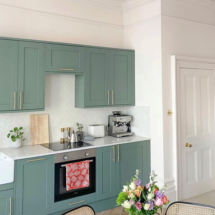 Kitchen with green kitchen cabinets 