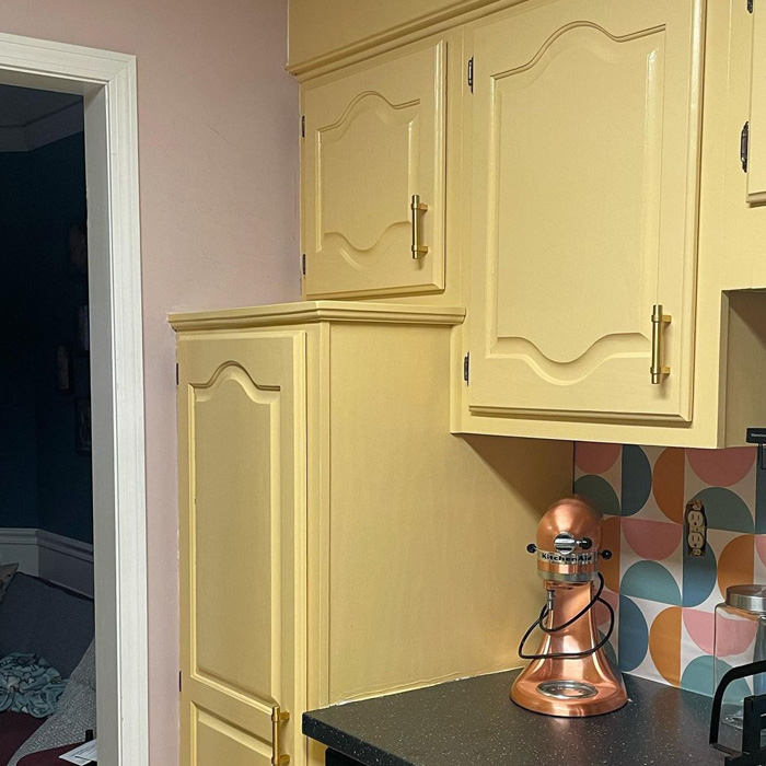 Yellow-painted kitchen cabinets 
