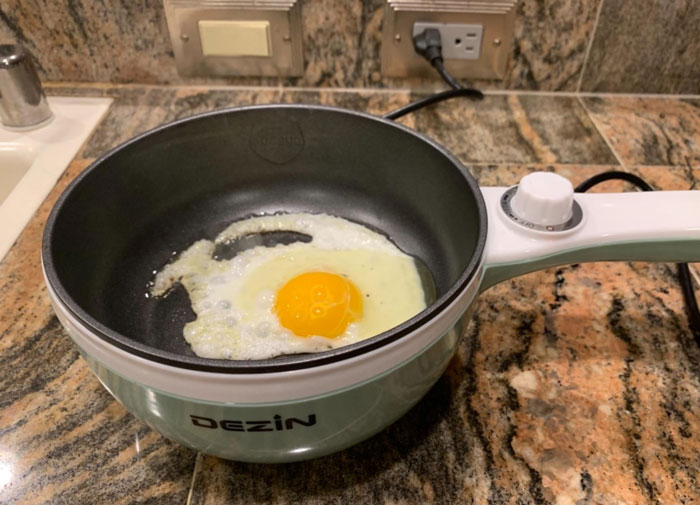 Dezin Electric Cooker: The gadget perfect for dorm residents and solo travelers that lets you cook and sauté without a stove, promising easy clean-up and healthy meals all while being compact and energy efficient!