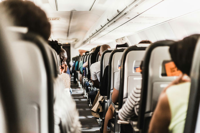 Man Called Out For Causing "Unnecessary Human Interaction" As He Mocks A Religious Lady On A Plane